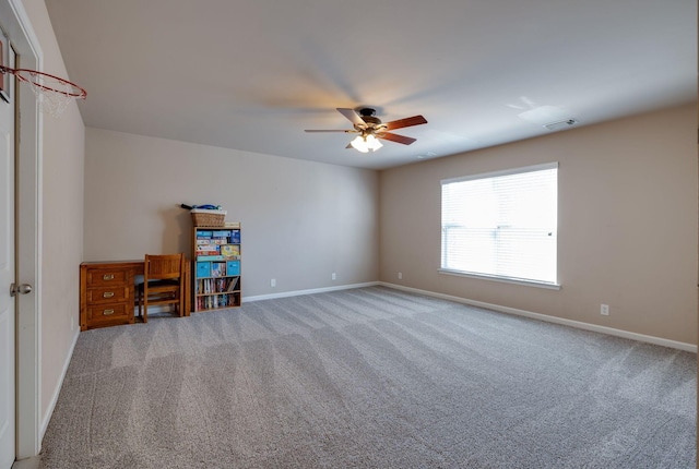 unfurnished room featuring ceiling fan, baseboards, visible vents, and carpet floors