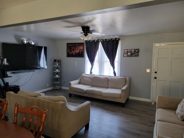 living room with wood finished floors, baseboards, and a ceiling fan