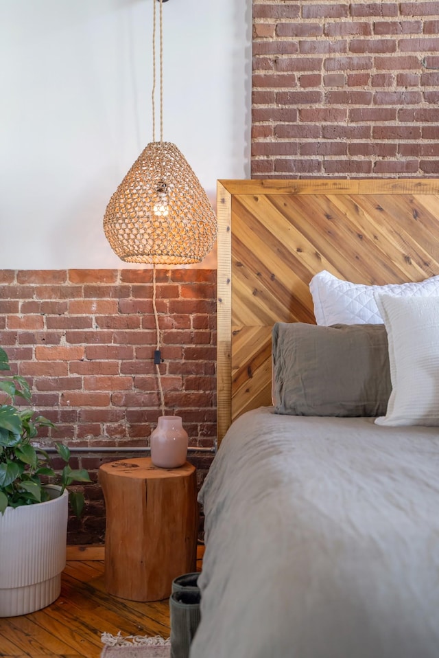 1400 Rosa L Parks Blvd Unit 318, Nashville, TN 37208 - bedroom featuring brick wall and wood finished floors