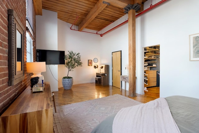 1400 Rosa L Parks Blvd Unit 318, Nashville, TN 37208 - bedroom with a spacious closet, wood ceiling, wood finished floors, a high ceiling, and beam ceiling