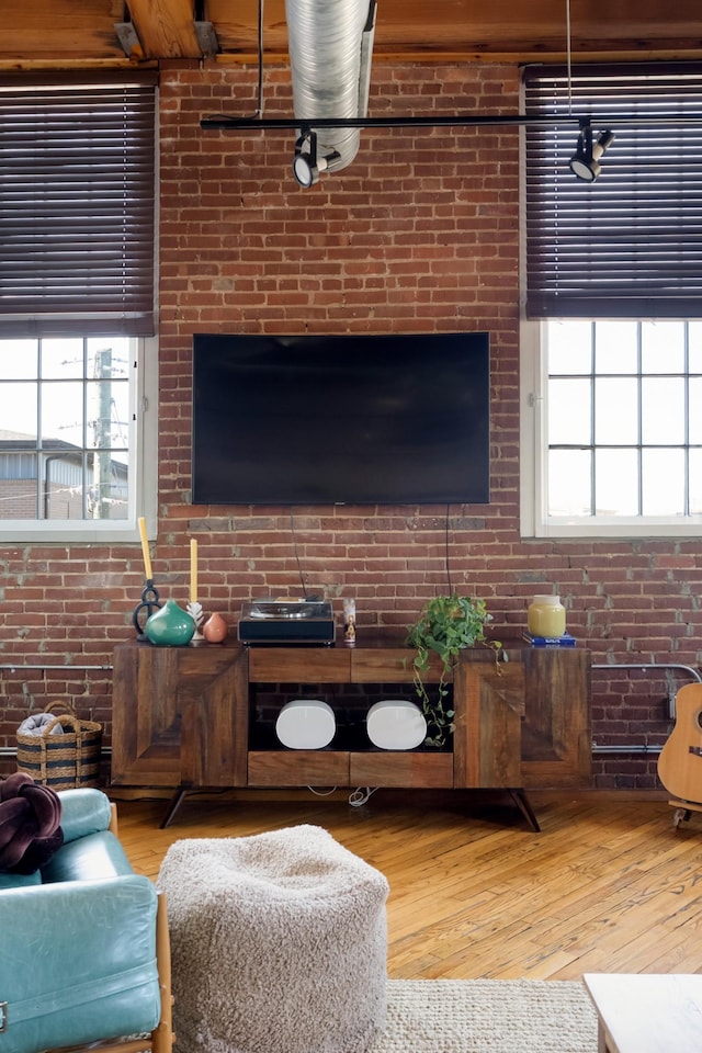 1400 Rosa L Parks Blvd Unit 318, Nashville, TN 37208 - living area with plenty of natural light, hardwood / wood-style flooring, and brick wall