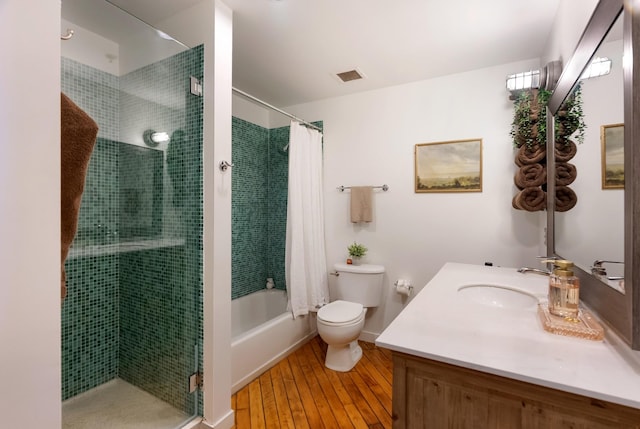 1400 Rosa L Parks Blvd Unit 318, Nashville, TN 37208 - full bathroom with visible vents, toilet, shower / bath combo with shower curtain, vanity, and wood finished floors