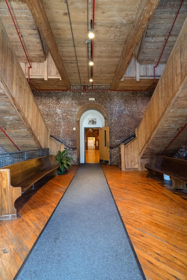 1400 Rosa L Parks Blvd Unit 318, Nashville, TN 37208 - interior space with wood-type flooring, rail lighting, beam ceiling, and brick wall