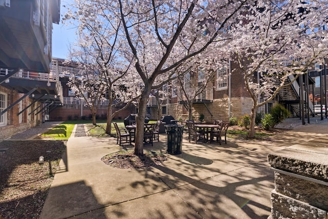 1400 Rosa L Parks Blvd Unit 318, Nashville, TN 37208 - view of patio / terrace featuring stairway and outdoor dining area