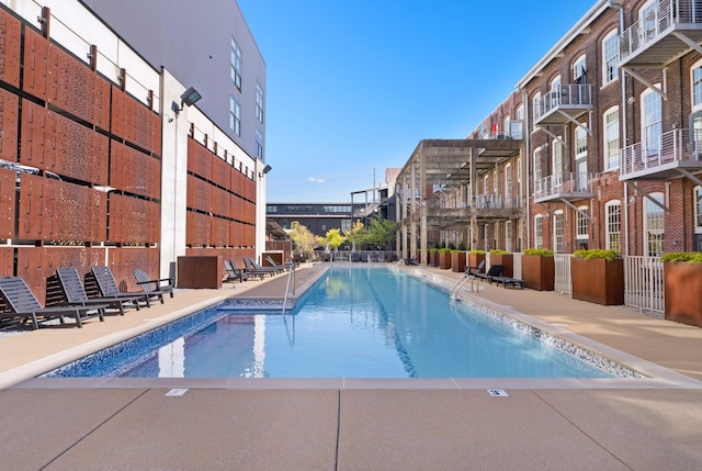 1400 Rosa L Parks Blvd Unit 318, Nashville, TN 37208 - community pool featuring a patio area and fence