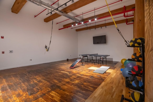1400 Rosa L Parks Blvd Unit 318, Nashville, TN 37208 - game room with rail lighting, wood-type flooring, and baseboards