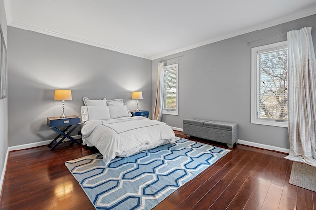 bedroom with crown molding, baseboards, and hardwood / wood-style floors
