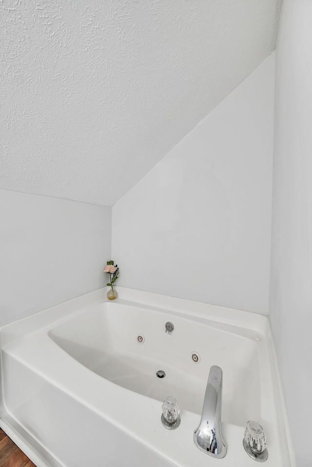 2712 Long Hollow Pike, Hendersonville, TN 37075 - full bathroom featuring lofted ceiling, a tub with jets, and a textured ceiling