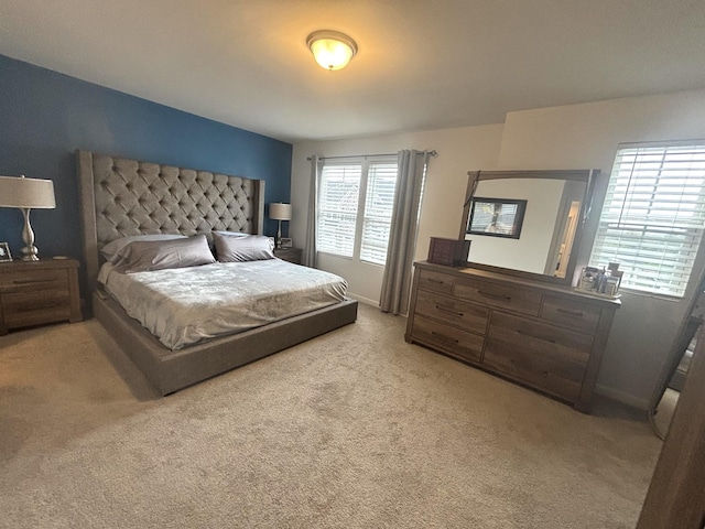 carpeted bedroom with baseboards