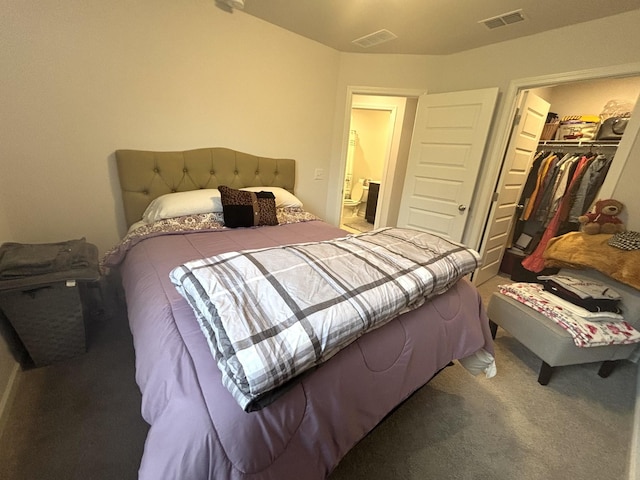 carpeted bedroom with visible vents, a spacious closet, and a closet