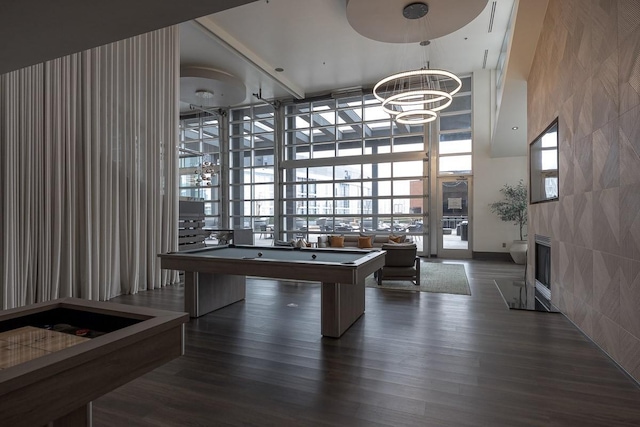 600 12th Ave S Unit 521, Nashville, TN 37203 - rec room with dark wood-type flooring, billiards, a chandelier, and a towering ceiling