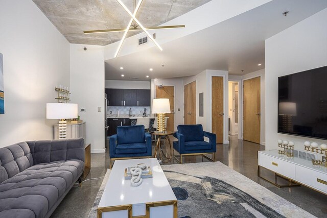 600 12th Ave S Unit 521, Nashville, TN 37203 - living room featuring concrete floors, electric panel, recessed lighting, a ceiling fan, and visible vents