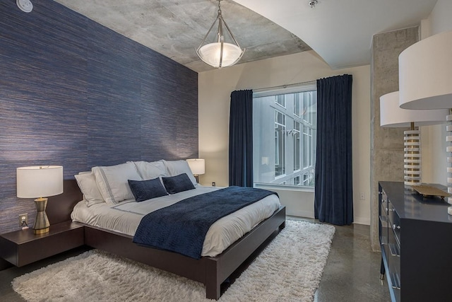 600 12th Ave S Unit 521, Nashville, TN 37203 - bedroom with finished concrete floors and an accent wall