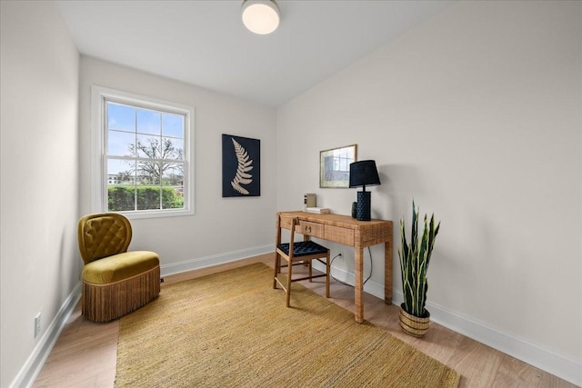 home office featuring light wood-style flooring and baseboards