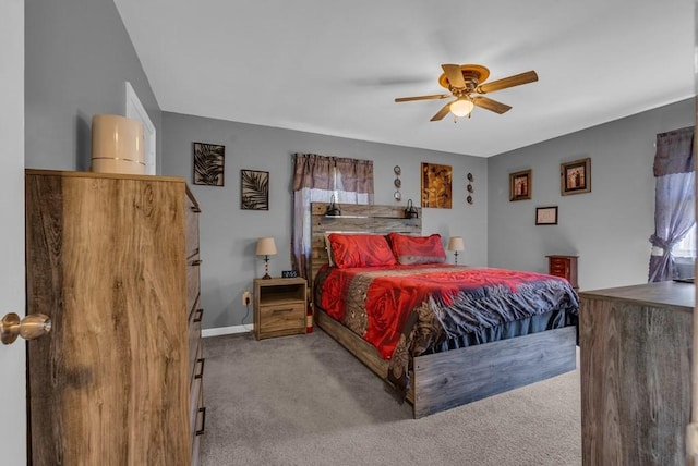 carpeted bedroom featuring multiple windows, baseboards, and ceiling fan