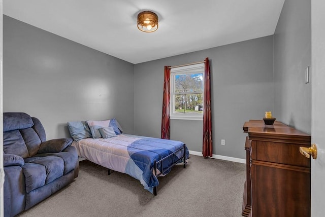 carpeted bedroom with baseboards