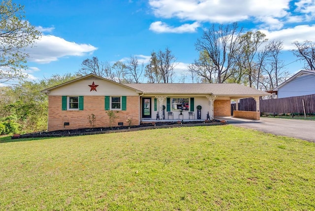single story home featuring a carport, driveway, a front yard, and brick siding