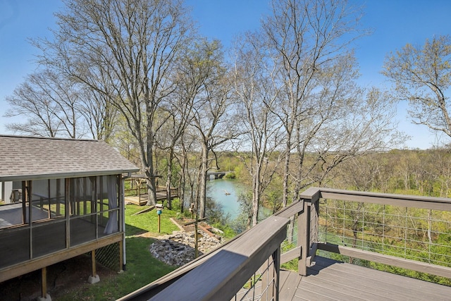 wooden deck with a water view and a sunroom