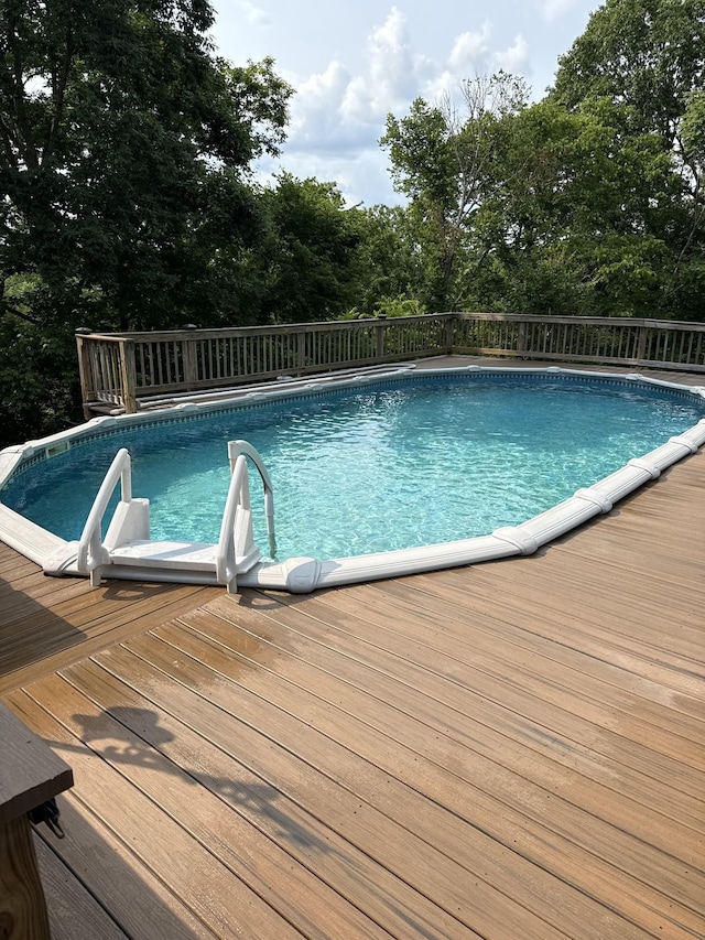 115 Cragfont Rd, Castalian Springs, TN 37031 - swimming pool with a wooden deck and view of scattered trees