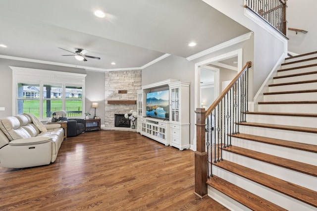 2042 Imagine Cir, Spring Hill, TN 37174 - living area featuring ornamental molding, ceiling fan, wood finished floors, a stone fireplace, and stairs