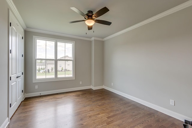 2042 Imagine Cir, Spring Hill, TN 37174 - spare room with crown molding, dark wood finished floors, a ceiling fan, and baseboards