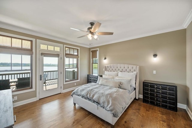 bedroom with baseboards, crown molding, access to exterior, a water view, and wood finished floors