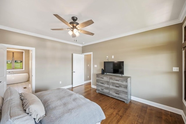 bedroom with ornamental molding, baseboards, and wood finished floors