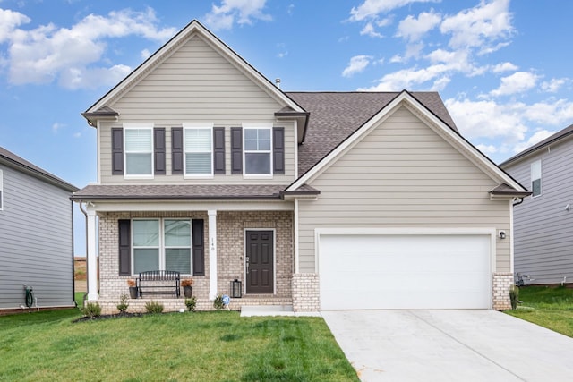 view of front facade with a porch, a front lawn, brick siding, an attached garage, and concrete driveway
