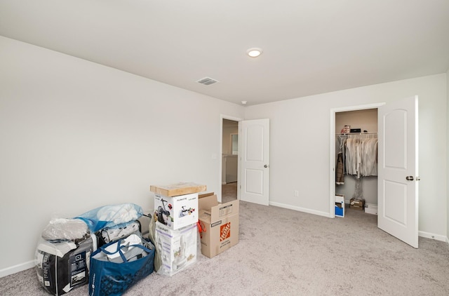 interior space with baseboards, visible vents, and carpet floors