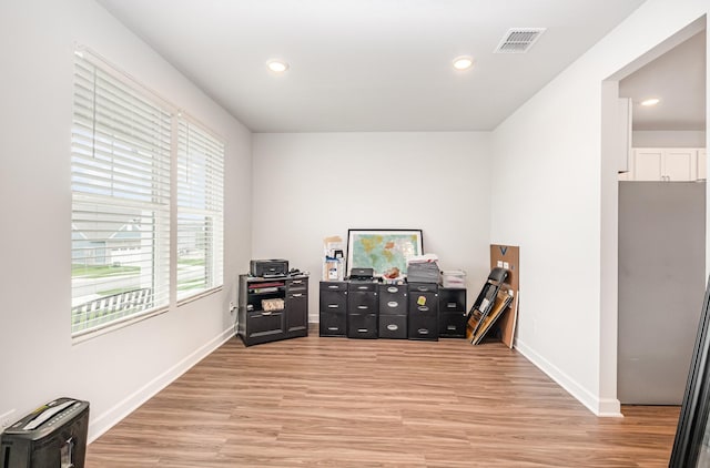 office with recessed lighting, visible vents, baseboards, and light wood-style flooring
