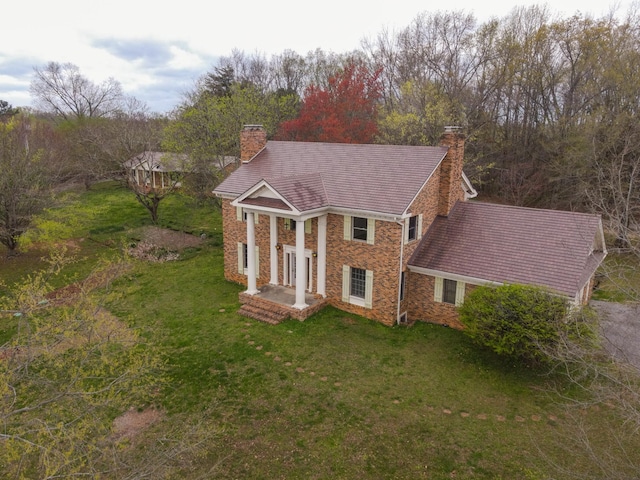 1601 Harvie Mills Rd W, Cookeville, TN 38501 - neoclassical / greek revival house featuring a chimney, a front yard, and stone siding
