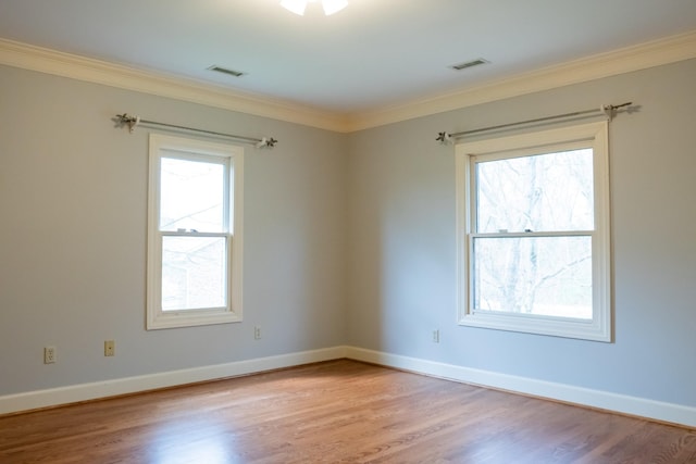 1601 Harvie Mills Rd W, Cookeville, TN 38501 - empty room with light wood-type flooring, crown molding, baseboards, and visible vents