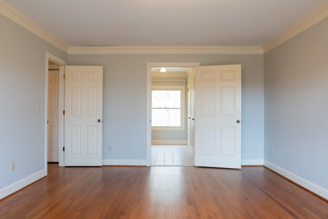 1601 Harvie Mills Rd W, Cookeville, TN 38501 - spare room featuring wood finished floors, baseboards, and ornamental molding