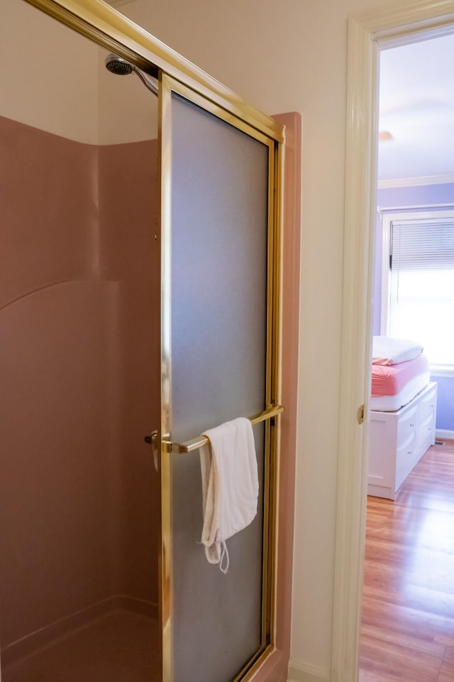 1601 Harvie Mills Rd W, Cookeville, TN 38501 - bathroom with a shower with door, wood finished floors, and crown molding