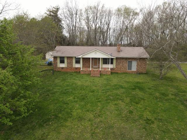 1601 Harvie Mills Rd W, Cookeville, TN 38501 - ranch-style home featuring a front yard, covered porch, and a chimney