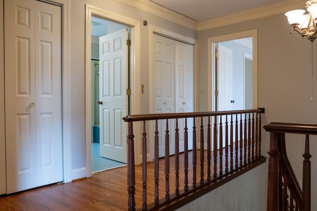 1601 Harvie Mills Rd W, Cookeville, TN 38501 - hallway with an upstairs landing, a notable chandelier, crown molding, and wood finished floors