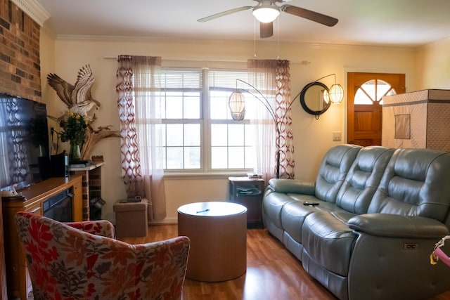 1601 Harvie Mills Rd W, Cookeville, TN 38501 - living area with a brick fireplace, a ceiling fan, ornamental molding, and wood finished floors