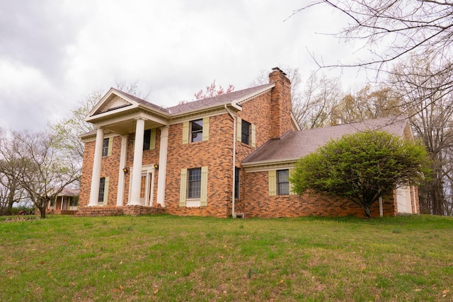 1601 Harvie Mills Rd W, Cookeville, TN 38501 - view of front of property with a front yard, brick siding, and a chimney
