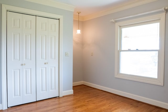 1601 Harvie Mills Rd W, Cookeville, TN 38501 - unfurnished bedroom featuring a closet, light wood finished floors, baseboards, and ornamental molding