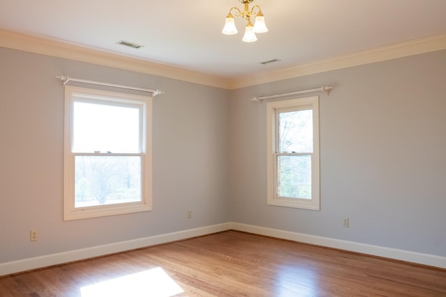 1601 Harvie Mills Rd W, Cookeville, TN 38501 - unfurnished room featuring visible vents, light wood finished floors, a notable chandelier, and baseboards