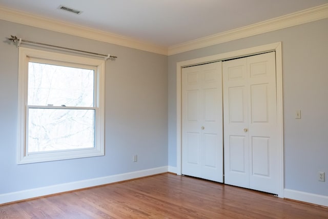1601 Harvie Mills Rd W, Cookeville, TN 38501 - unfurnished bedroom with visible vents, baseboards, and wood finished floors
