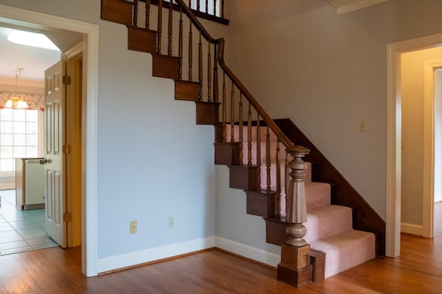 1601 Harvie Mills Rd W, Cookeville, TN 38501 - staircase with baseboards, an inviting chandelier, and wood finished floors