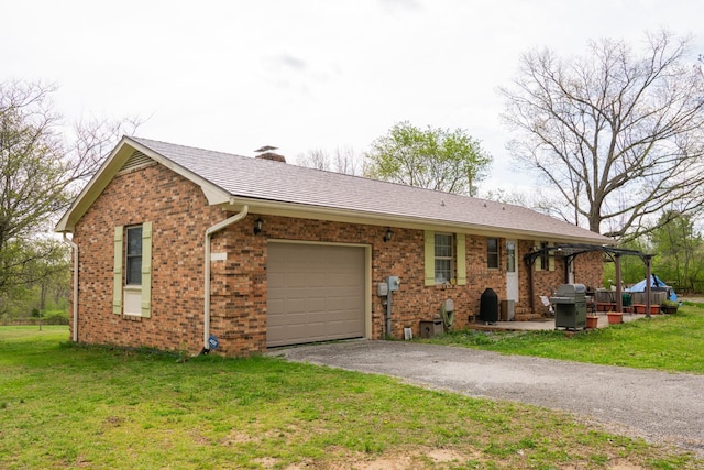 1601 Harvie Mills Rd W, Cookeville, TN 38501 - single story home with a garage, driveway, a front lawn, and brick siding
