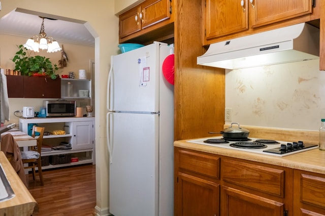 1601 Harvie Mills Rd W, Cookeville, TN 38501 - kitchen featuring white appliances, a chandelier, under cabinet range hood, light countertops, and brown cabinets