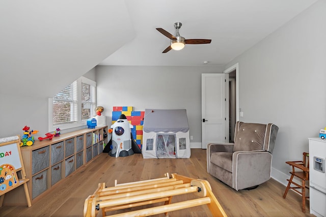 game room featuring wood finished floors, baseboards, and a ceiling fan