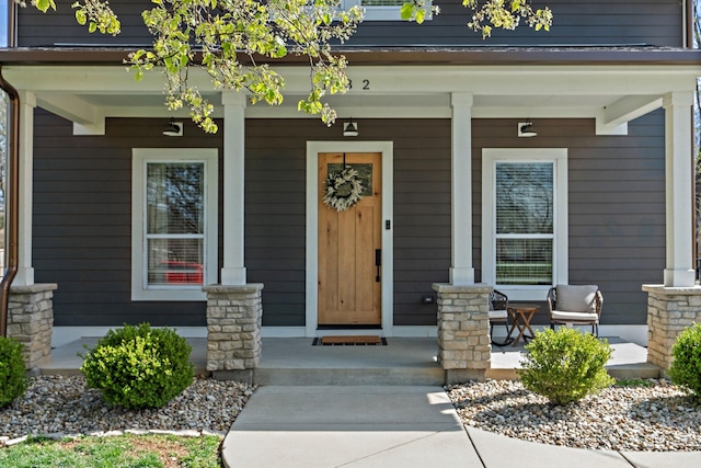 entrance to property featuring a porch