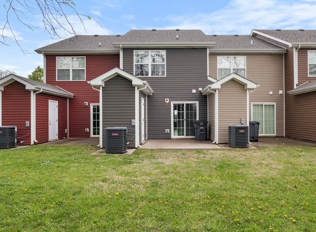 back of house featuring a patio area, central air condition unit, and a yard