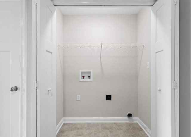 clothes washing area featuring hookup for an electric dryer, laundry area, baseboards, and washer hookup