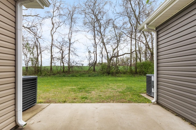 view of yard with a patio and central AC