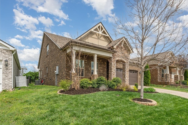 view of front facade with a front yard, a shingled roof, central air condition unit, brick siding, and driveway